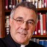 [Photo of Father Robert A. Sirico]
